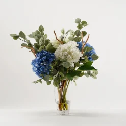 Cream and Blue Hydrangeas with Eucalyptus in Clear Glass Vase